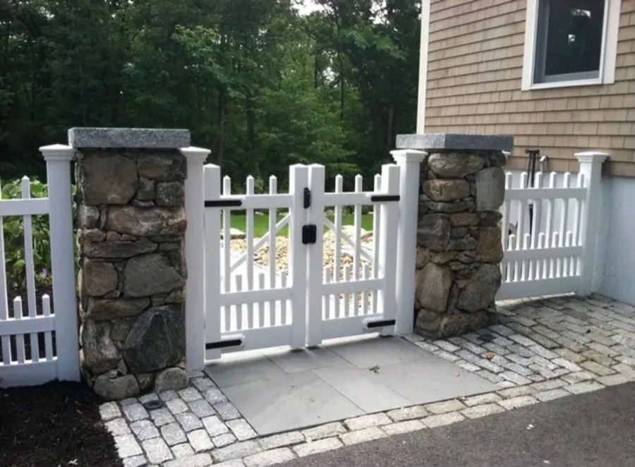 White vinyl gate with stone pillars by All Fenced In