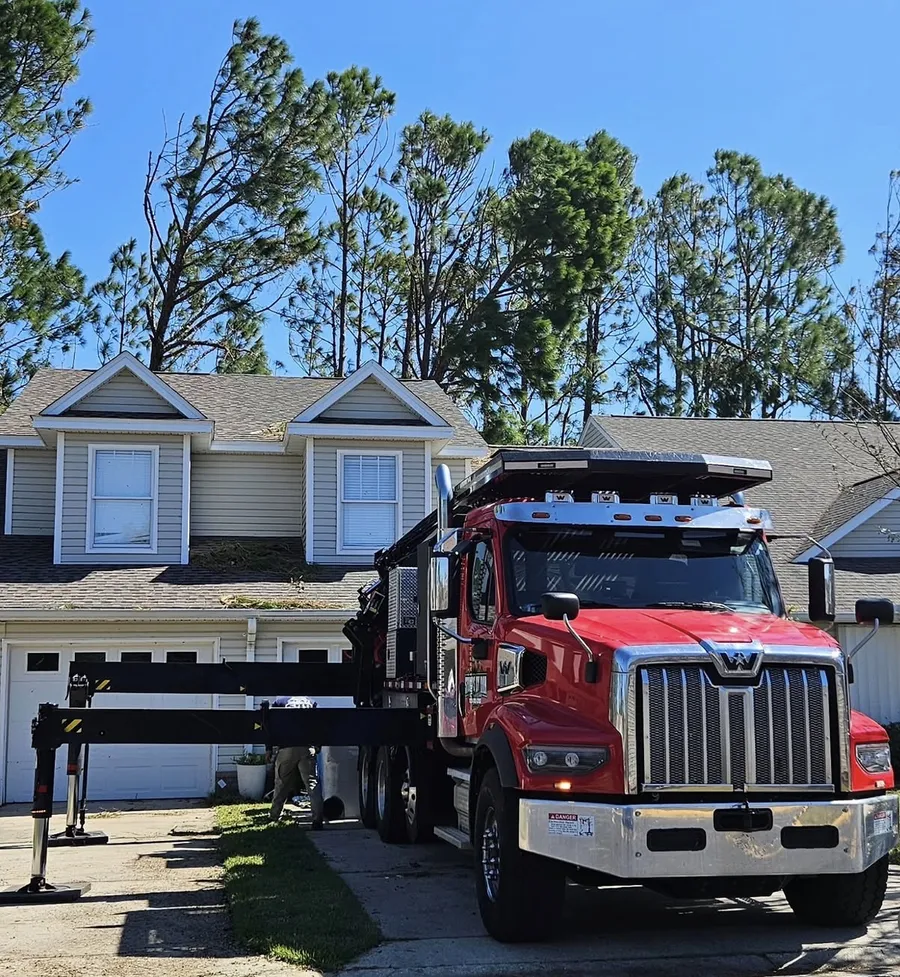 Stumps By Dan crane truck set up on site for Gulf Coast storm work