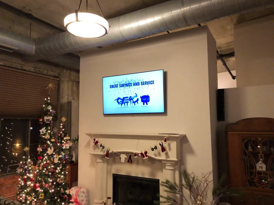 Commercial space with a TV mounted above a fireplace