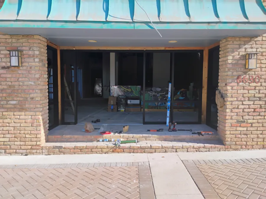 Storefront opening framed before glass