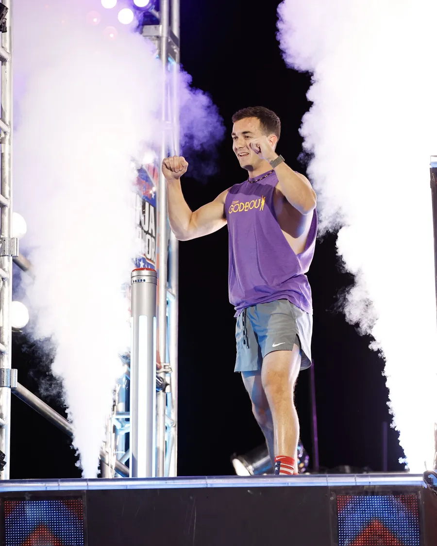 Jonathan Godbout celebrating on the American Ninja Warrior platform