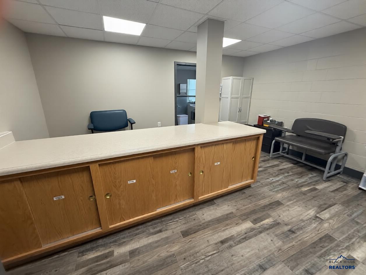 Front counter with wood cabinets and a waiting area