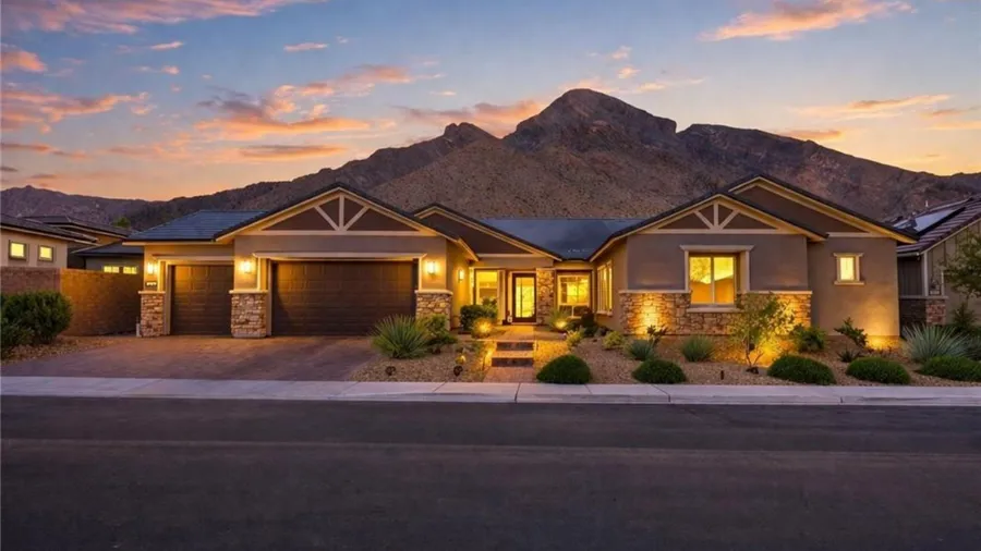 Las Vegas home at dusk with mountains behind it