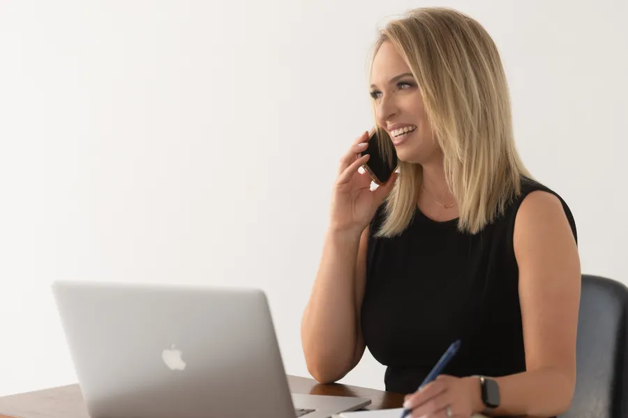 Jennifer Rodriguez on a call at her laptop