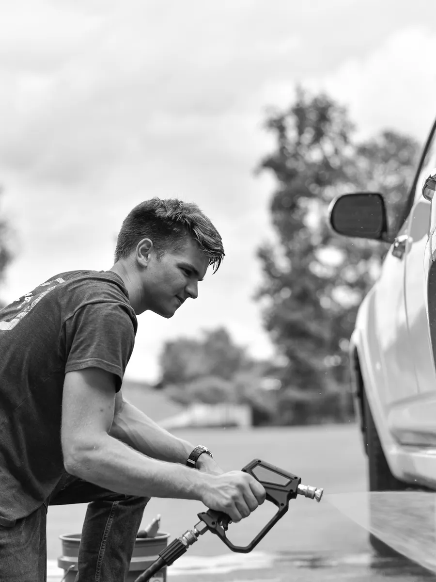 EWade Detailing technician washing a car