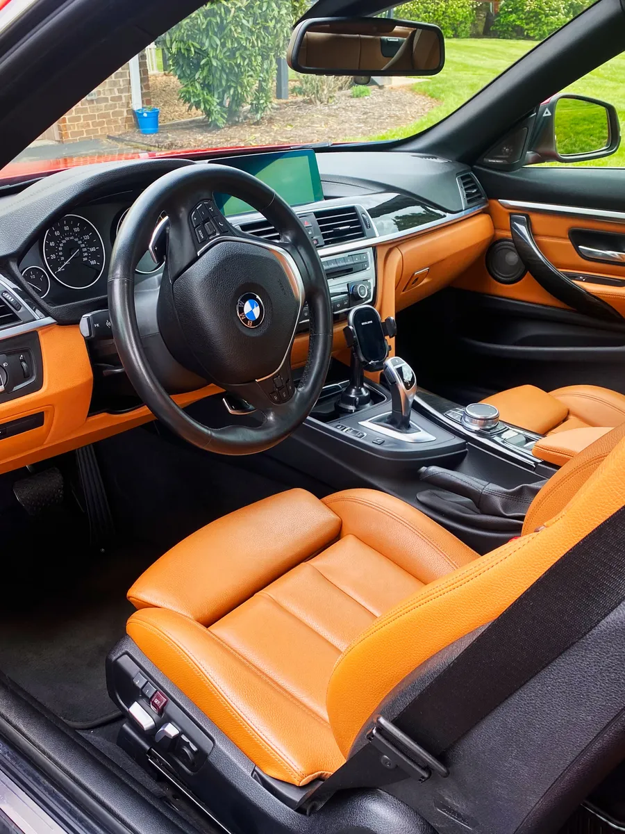 Same BMW front interior after the full detail