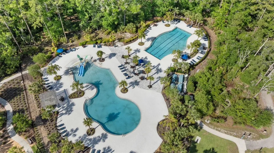 Aerial view of a resort-style pool and lounge deck in Bexley