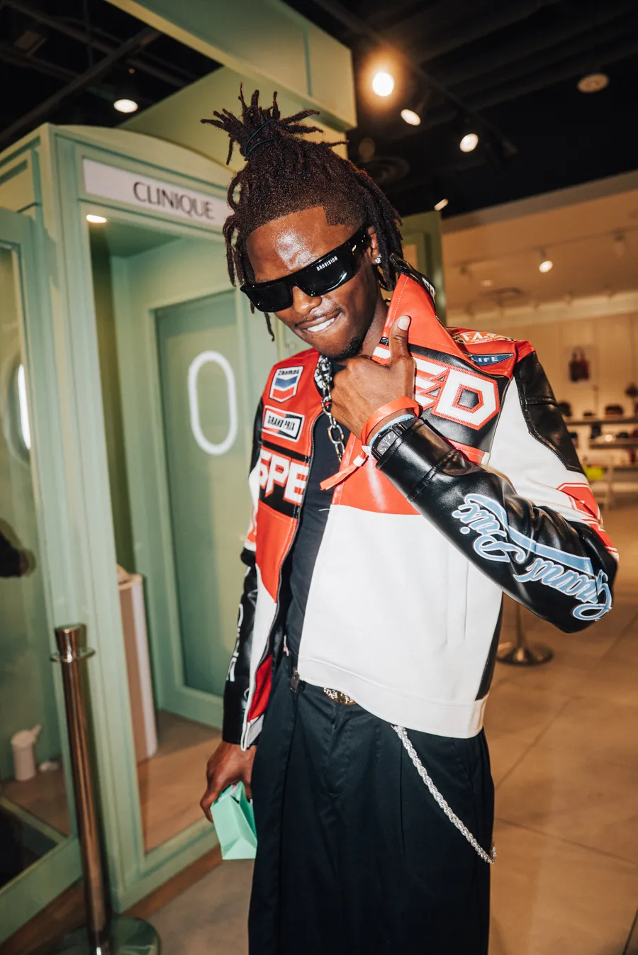 Guest in a varsity jacket at the event