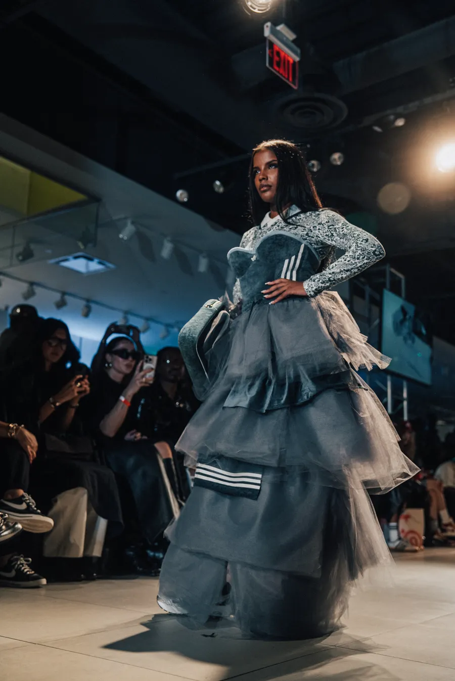 Model in a ruffled gown under the spotlights