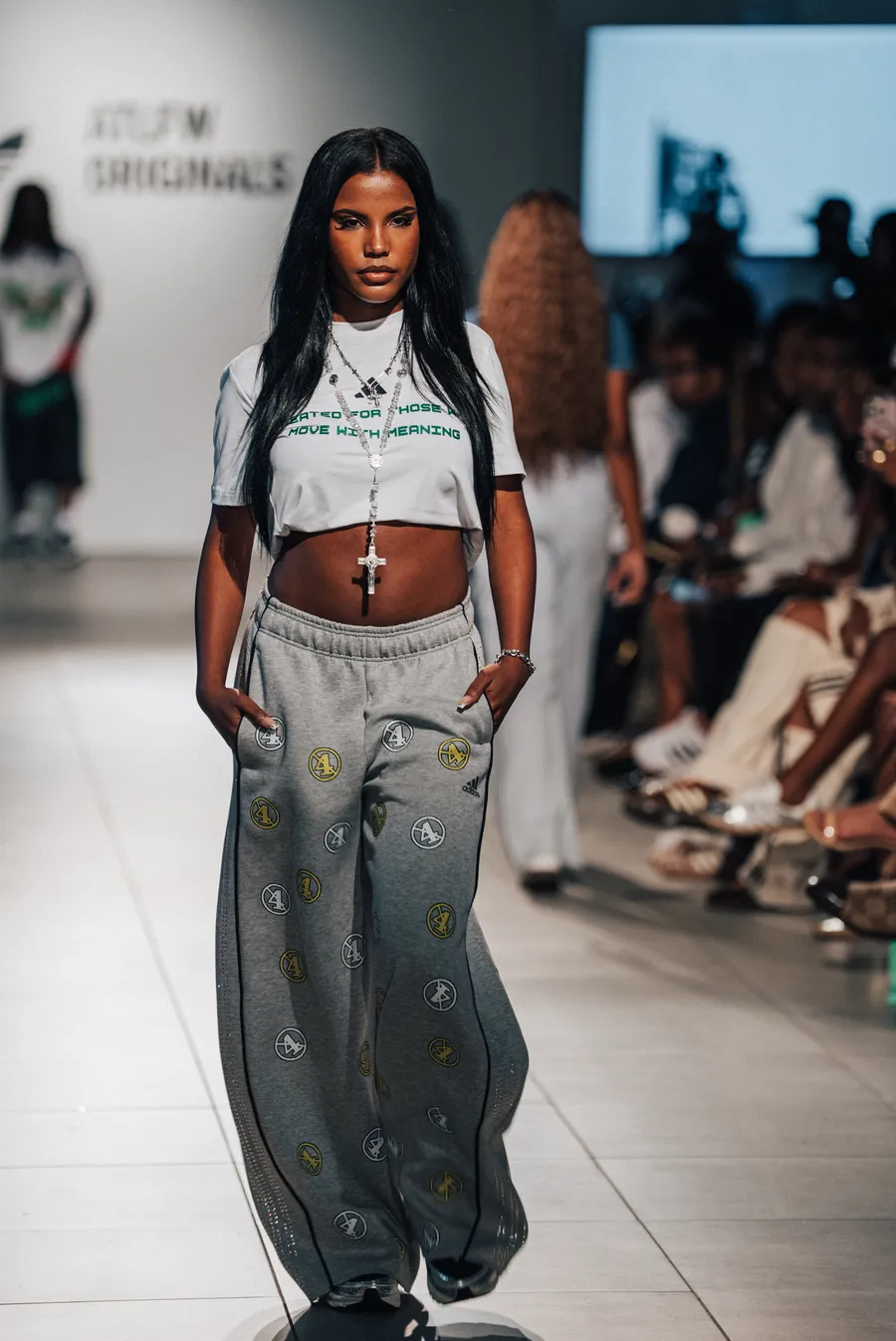 Model in a crop top and wide-leg pants