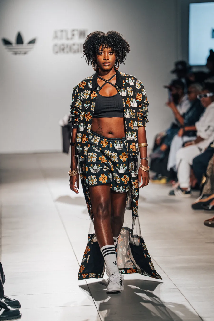 Model in a patterned set on the runway
