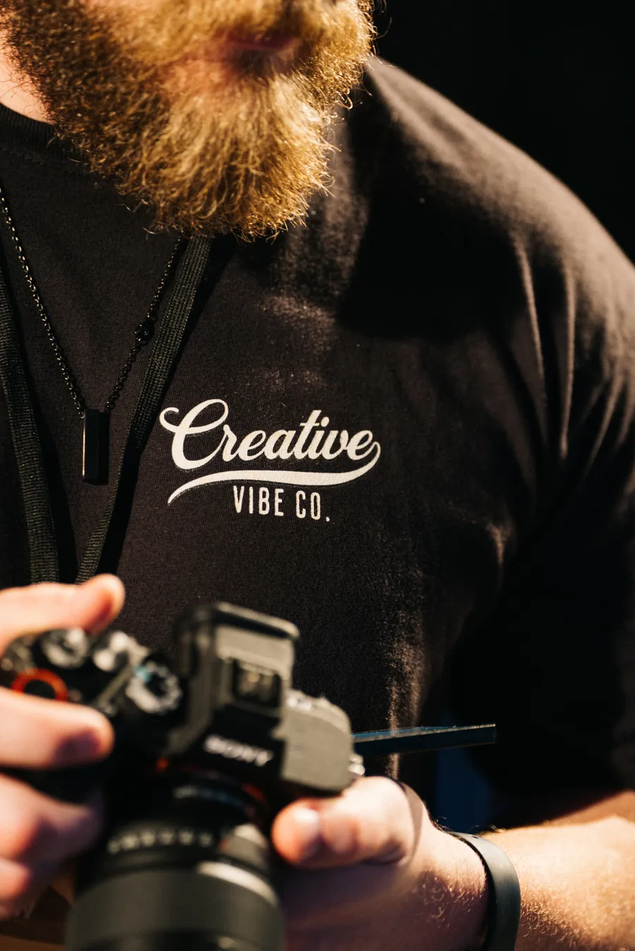 Close-up of a Creative Vibe tee and camera rig