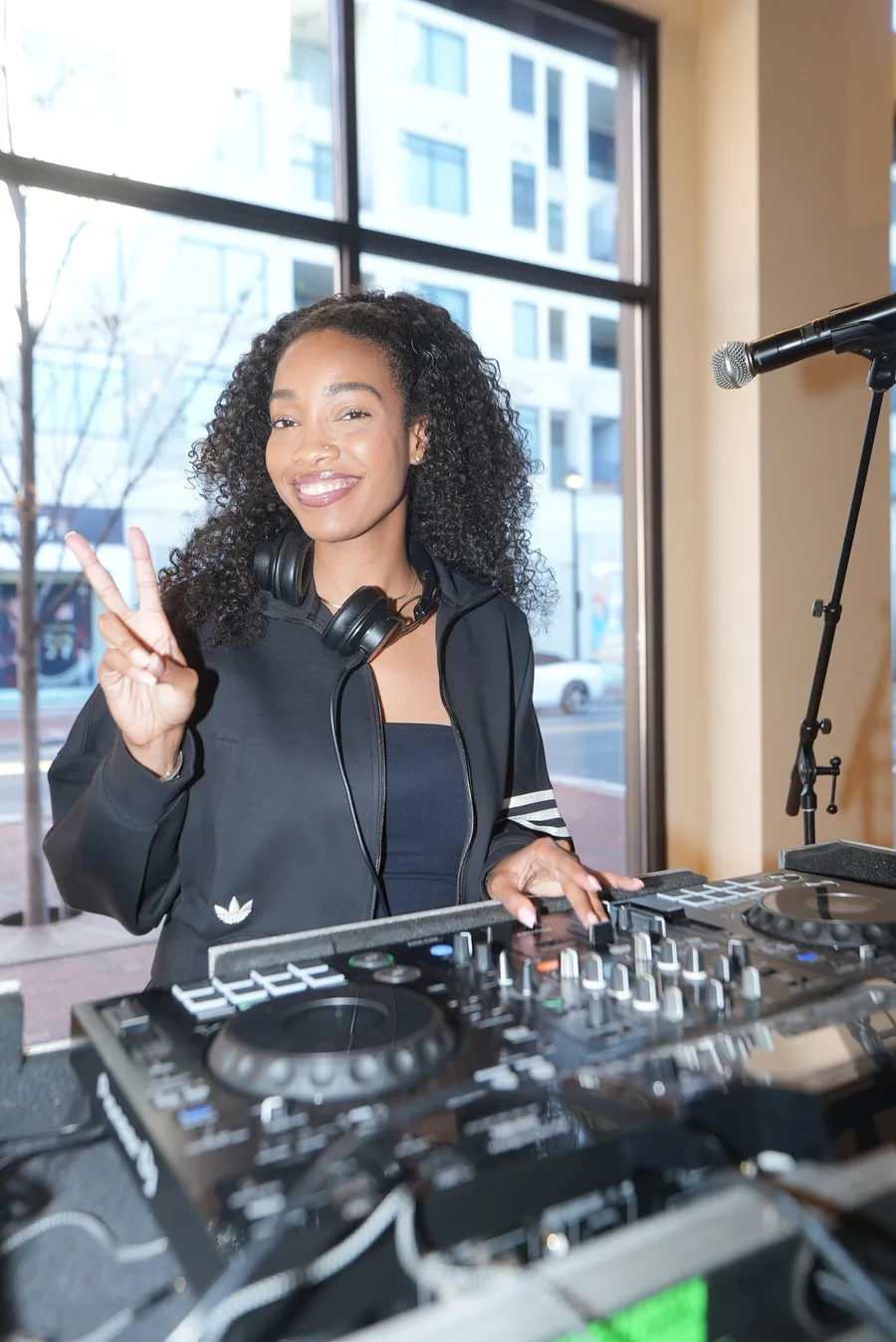 DJ playing a set by the window