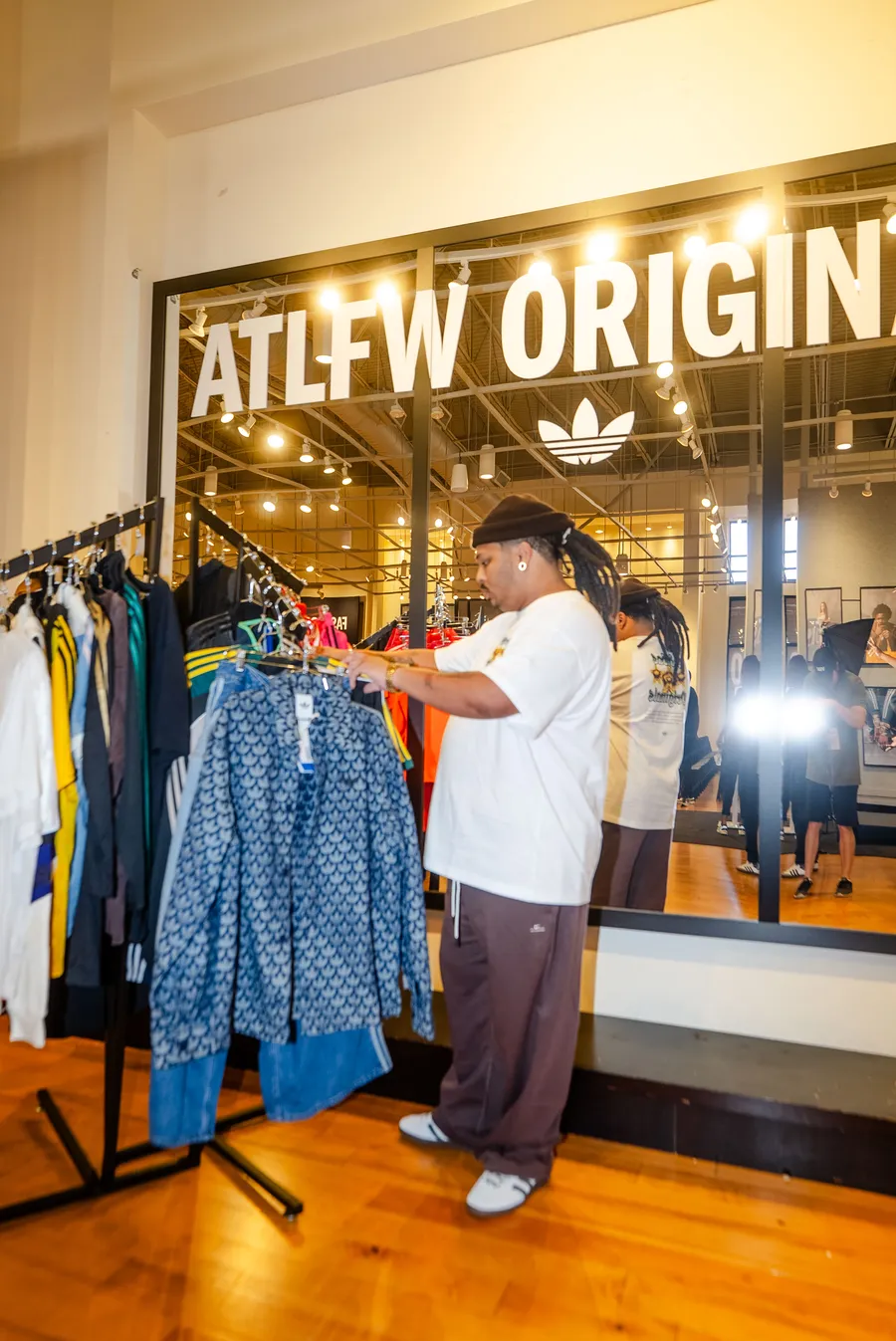 Shopper browsing the ATLFW Originals racks