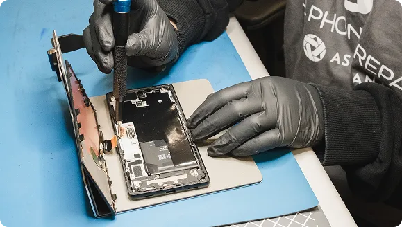 Technician repairing a Google Pixel