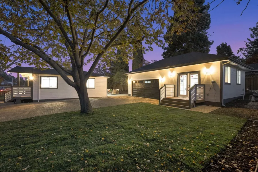 Detached ADU and garage at dusk