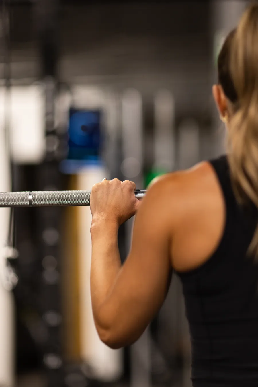 Shannon, 48, gripping a barbell