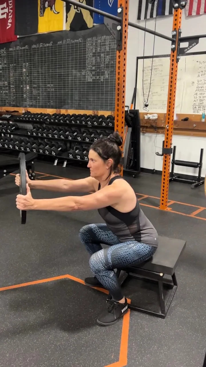 Susan, 55, doing a supported squat
