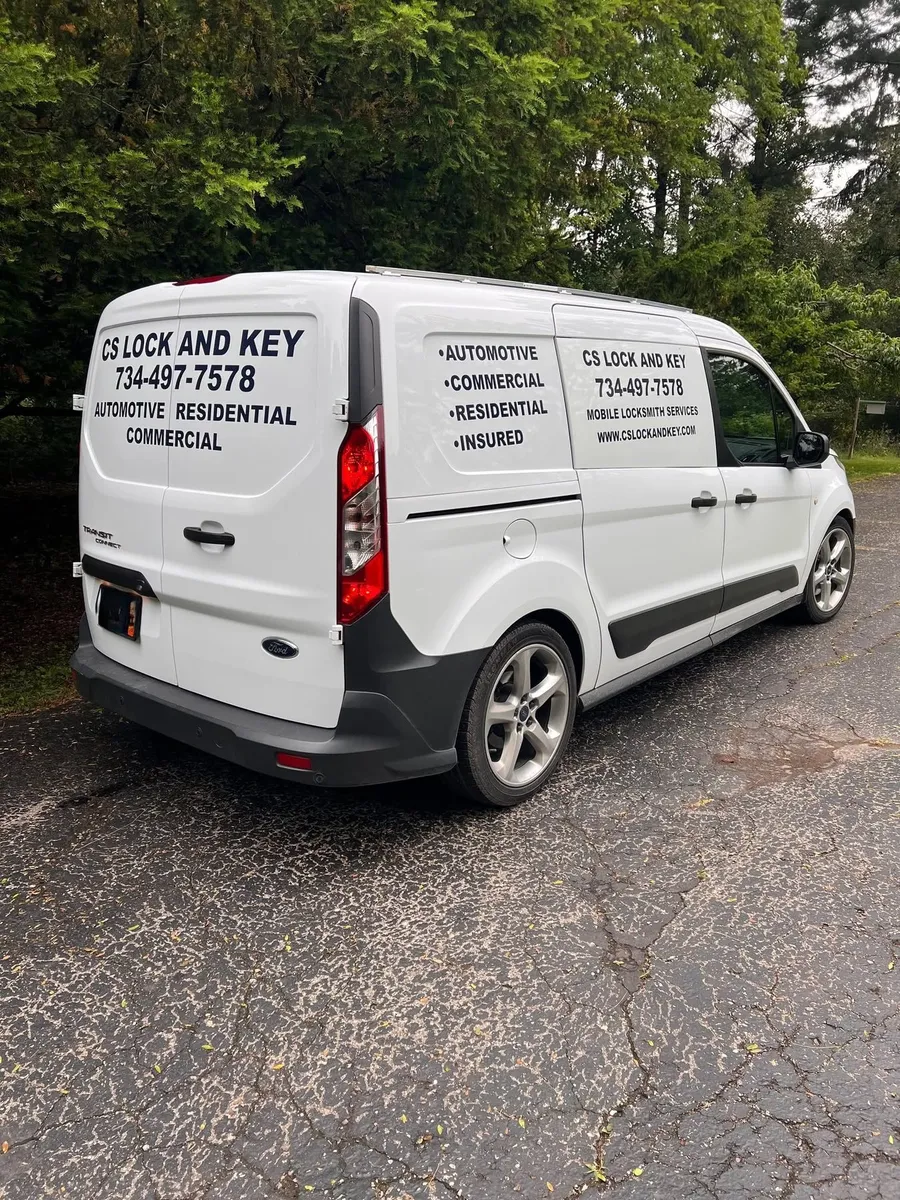 Rear of the CS Lock and Key van with its automotive, residential and commercial lettering