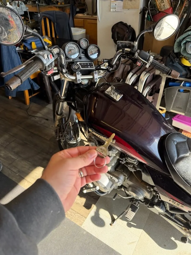 Key for a motorcycle parked in a home garage