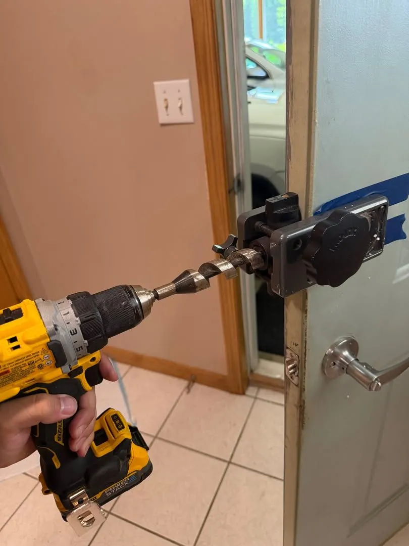 Drilling a door for a new lock