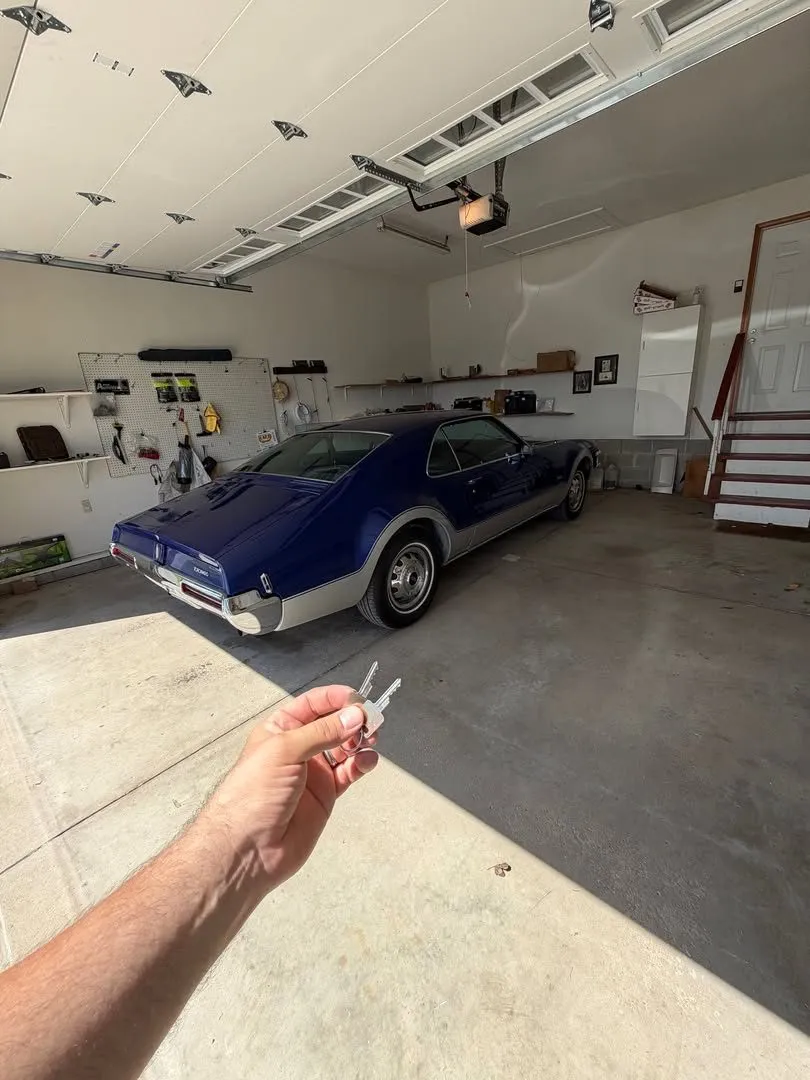 Key for a classic Oldsmobile Toronado in a garage