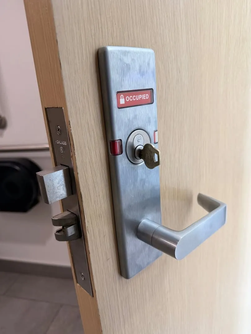 Mortise lever lock with an occupied indicator