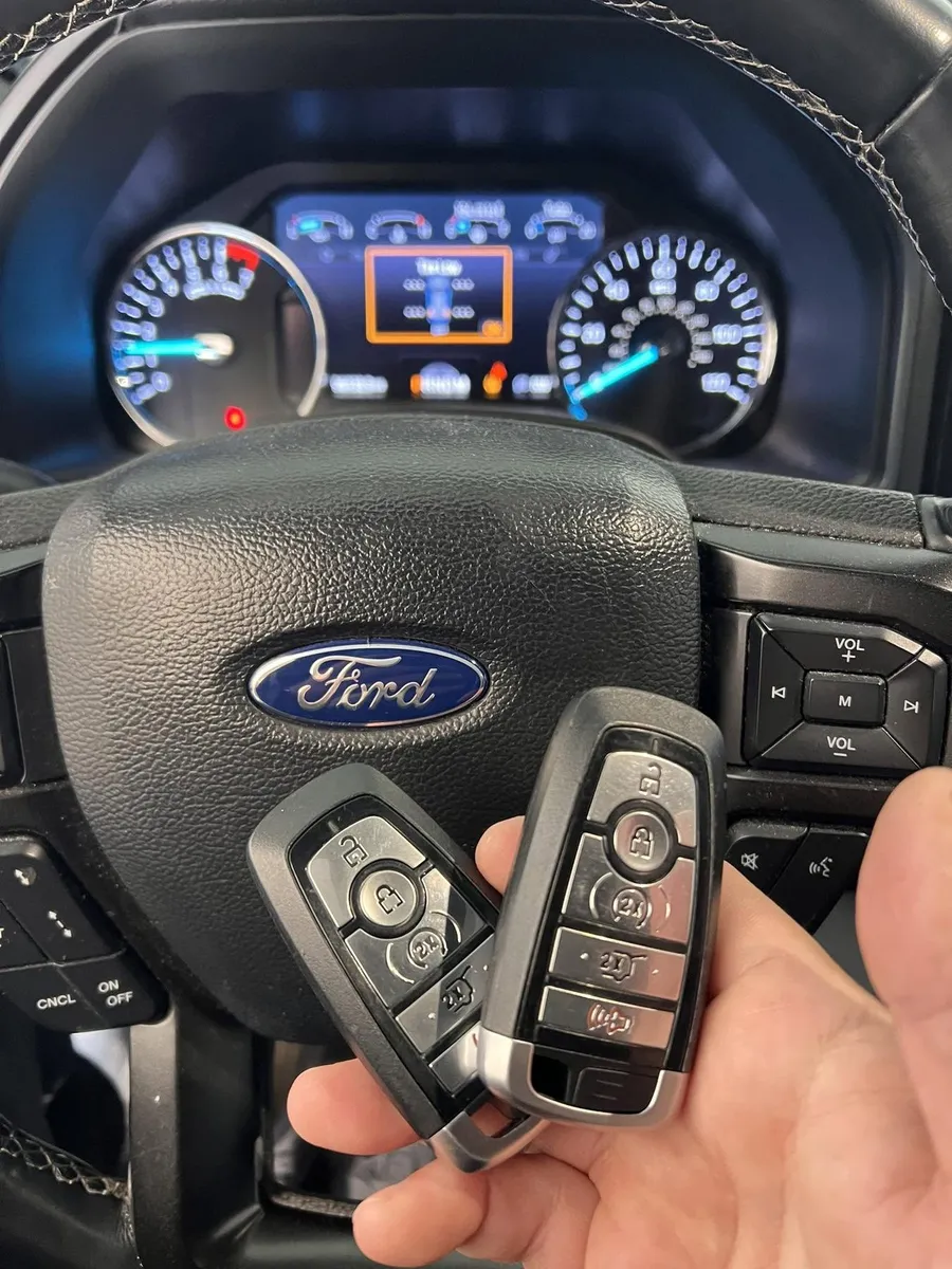 Two Ford smart keys at the steering wheel
