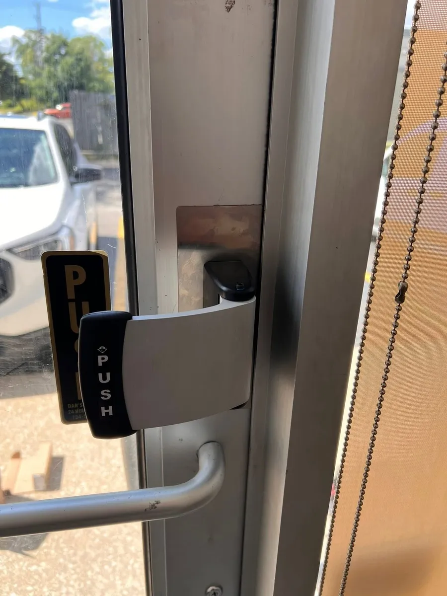 Push paddle handle on a storefront door