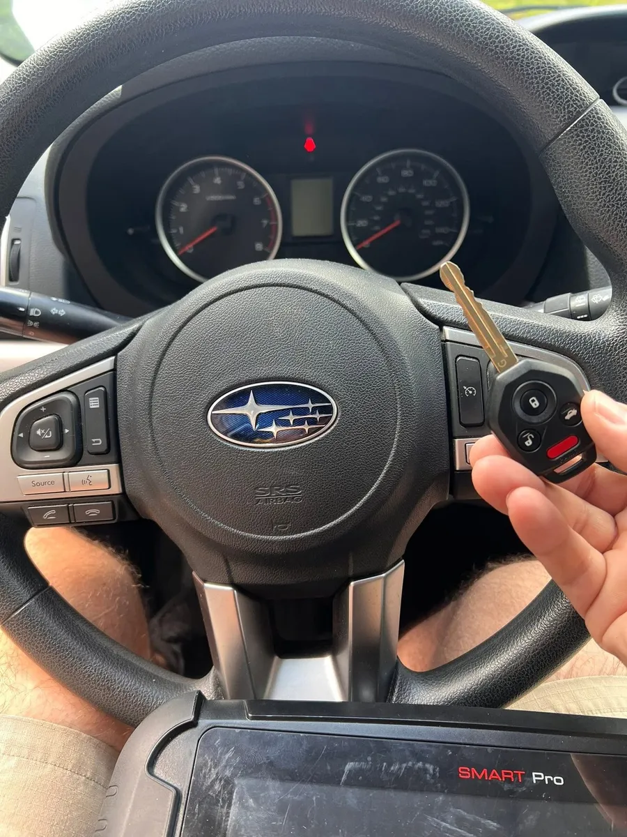 Subaru remote head key with a key programmer