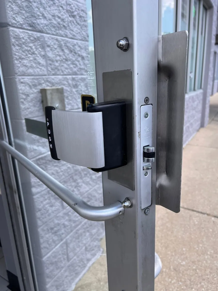 Lever hardware on a commercial storefront door