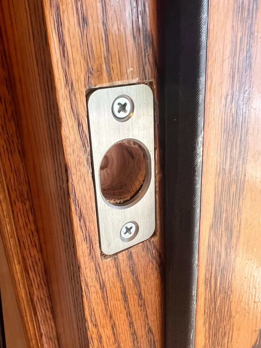 Deadbolt latch installed in a door edge