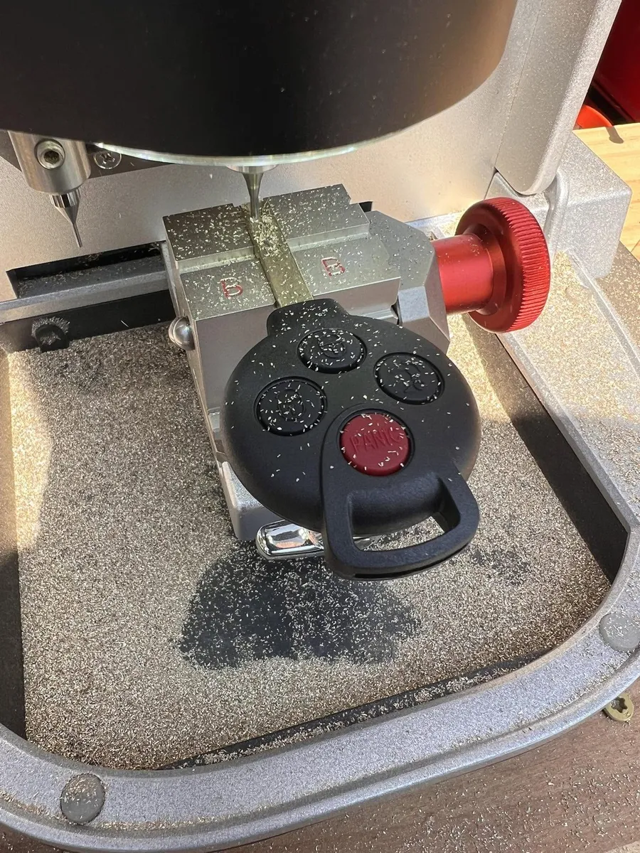 Remote head key in a key cutting machine