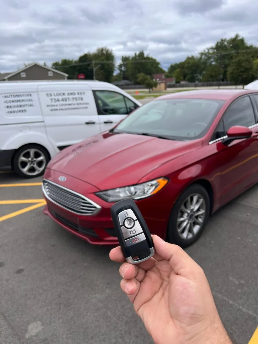 Smart key for a red Ford Fusion, with the CS Lock and Key van