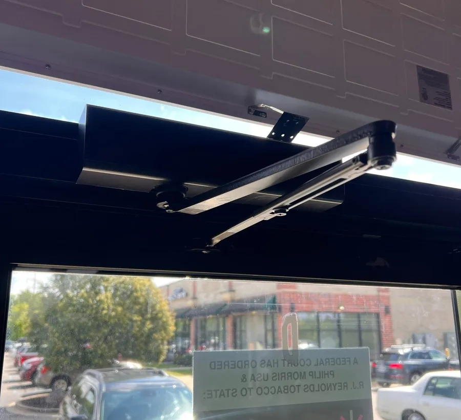 Door closer on a storefront entrance
