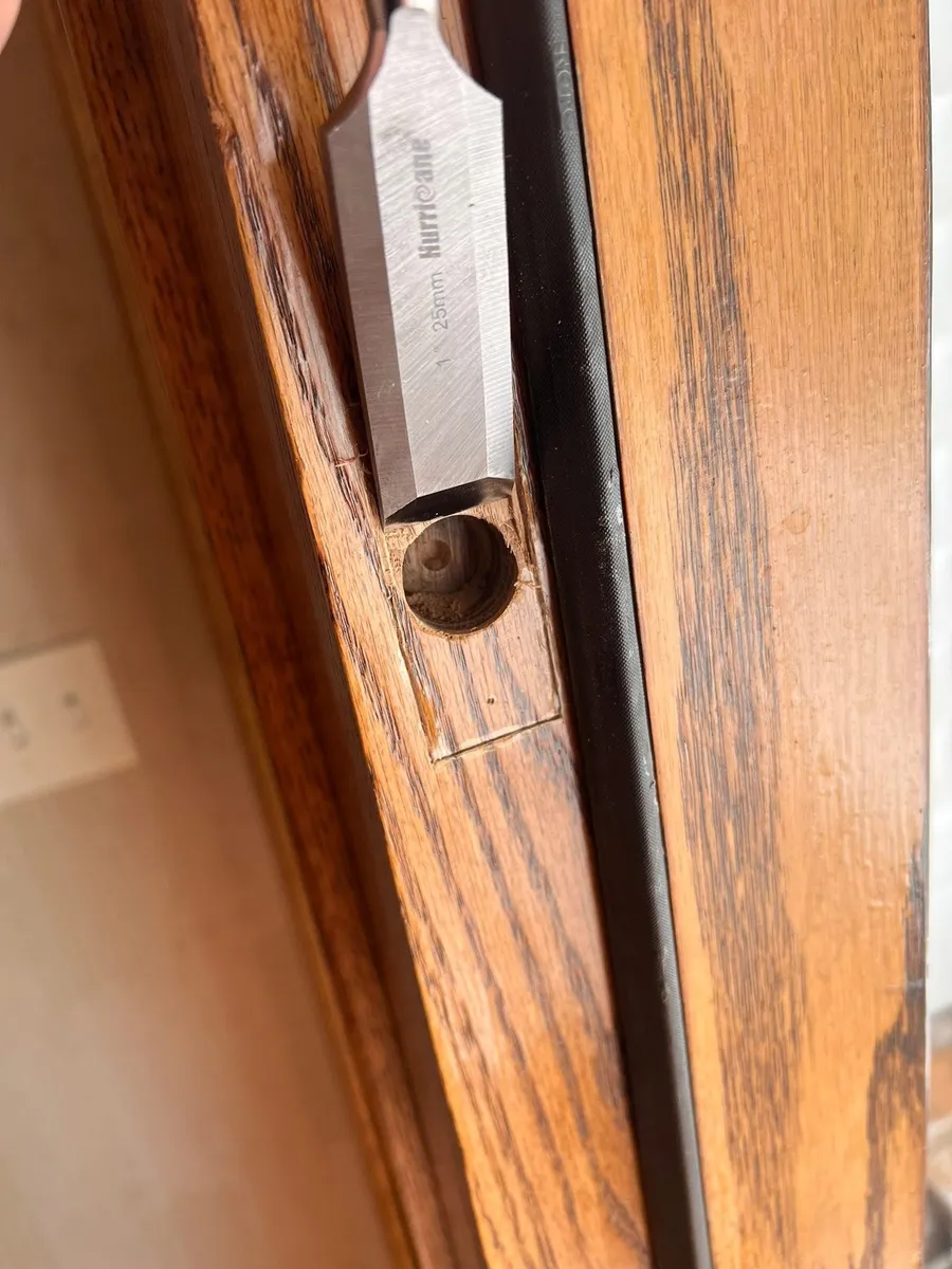 Door edge chiseled for a latch plate