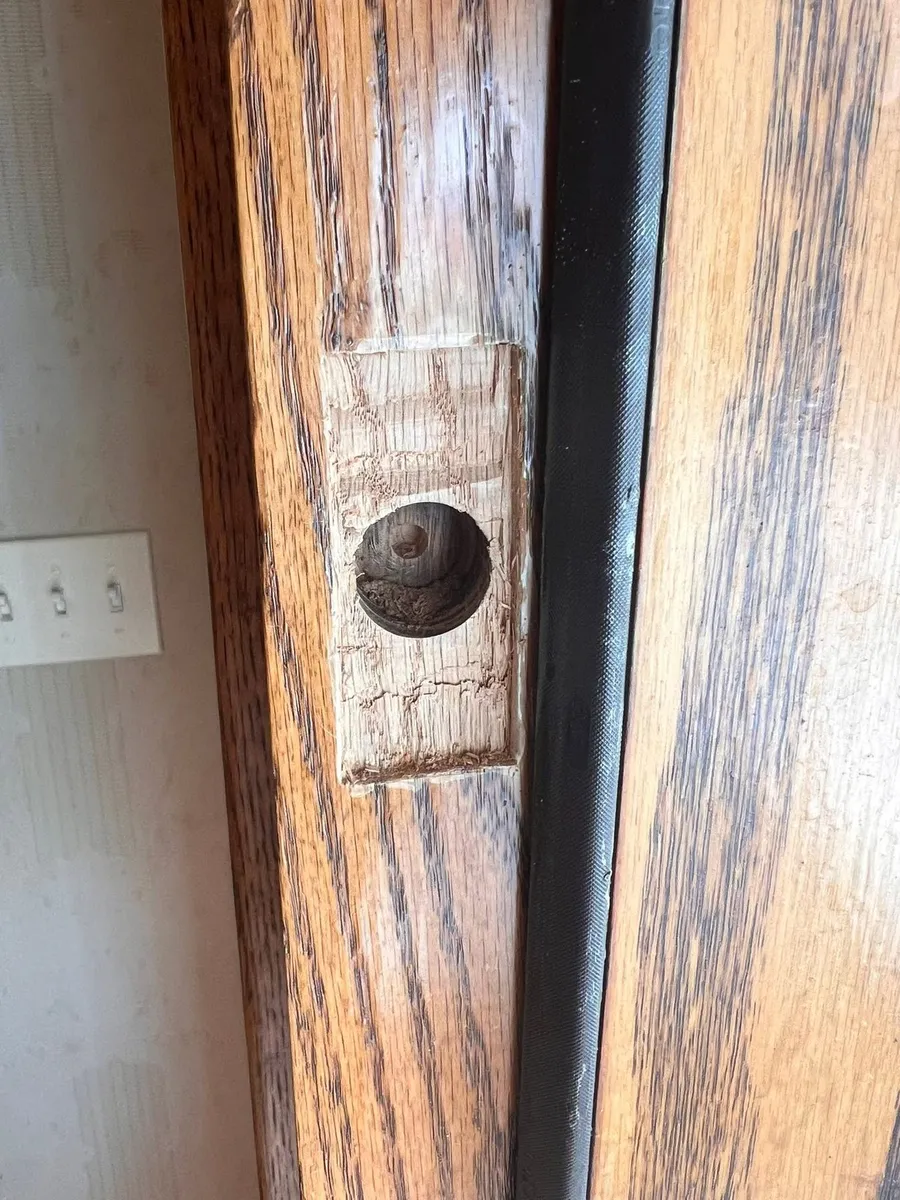 Door edge drilled for a latch