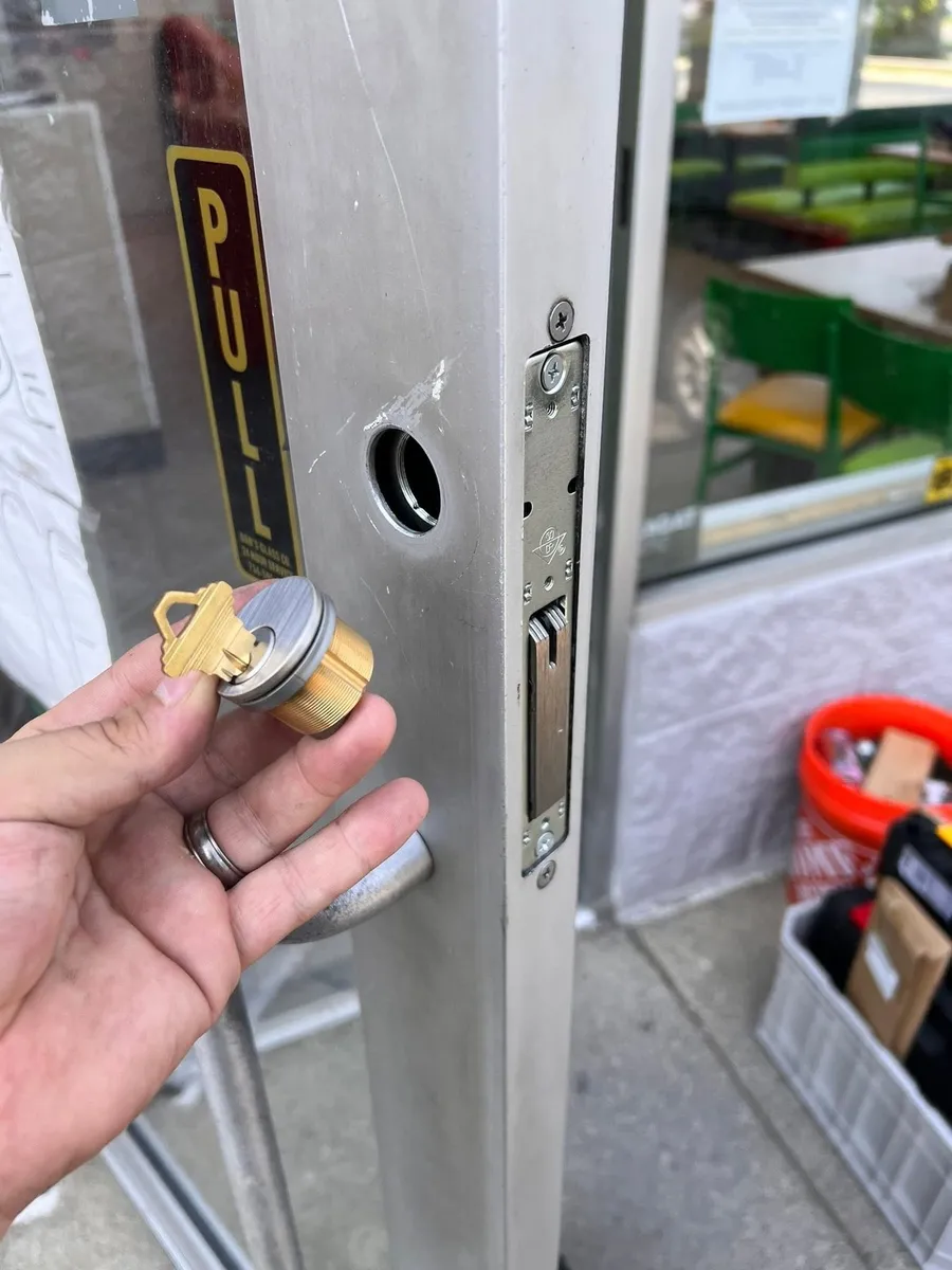 Mortise cylinder removed from a storefront door