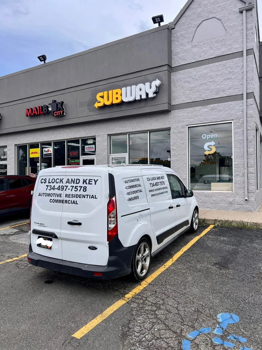 CS Lock and Key van parked at a restaurant