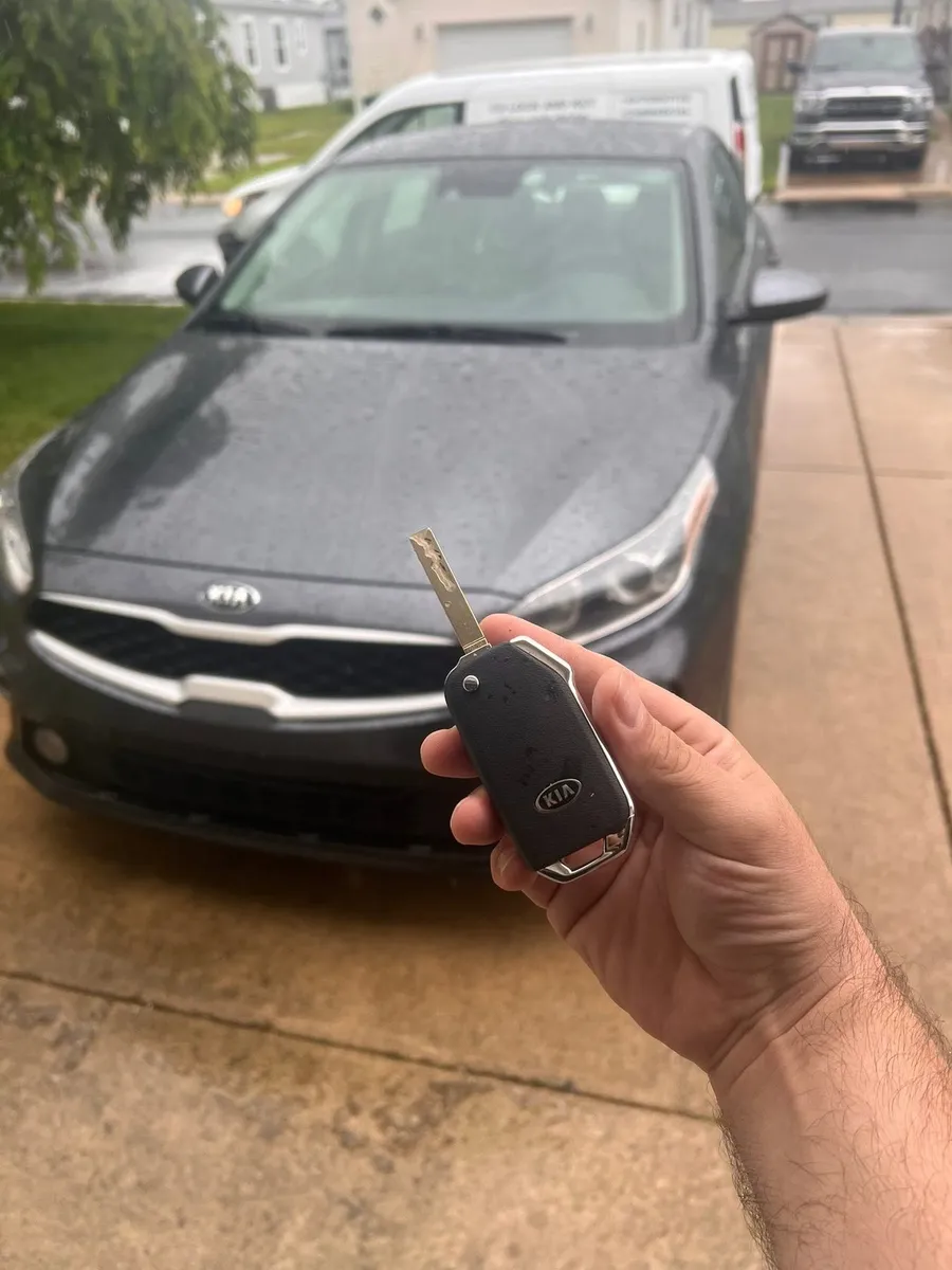 Flip key for a gray Kia sedan