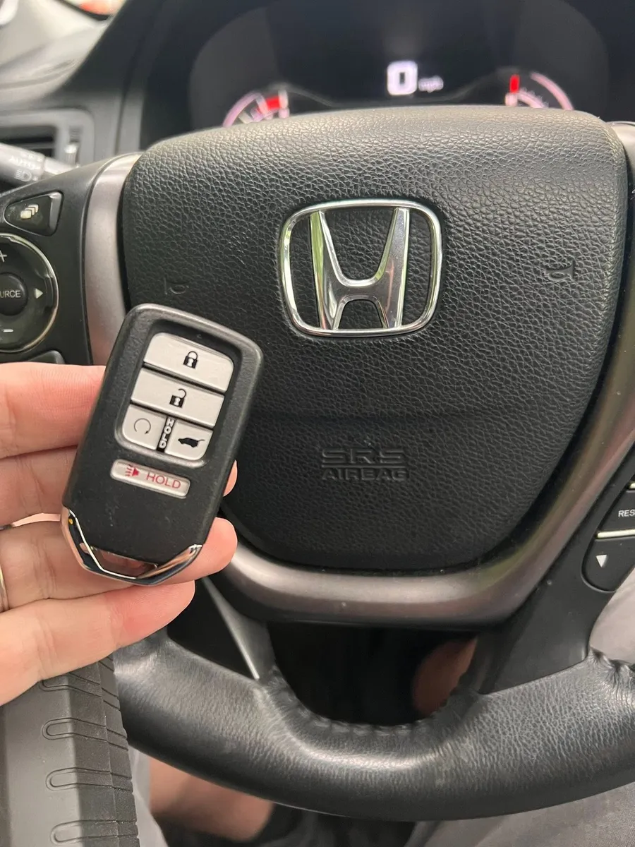Honda smart key at the steering wheel
