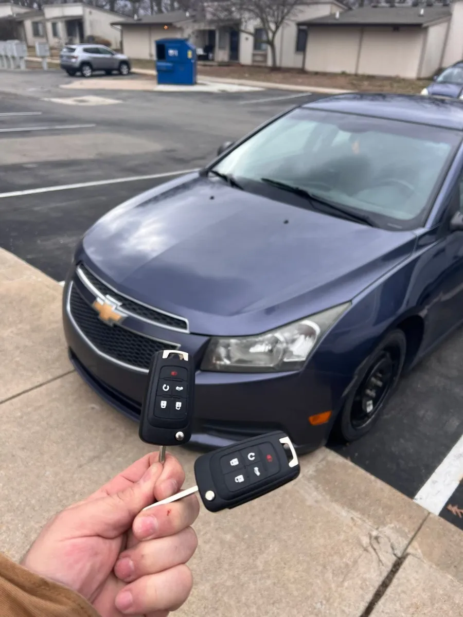 Two flip keys for a blue Chevrolet Cruze