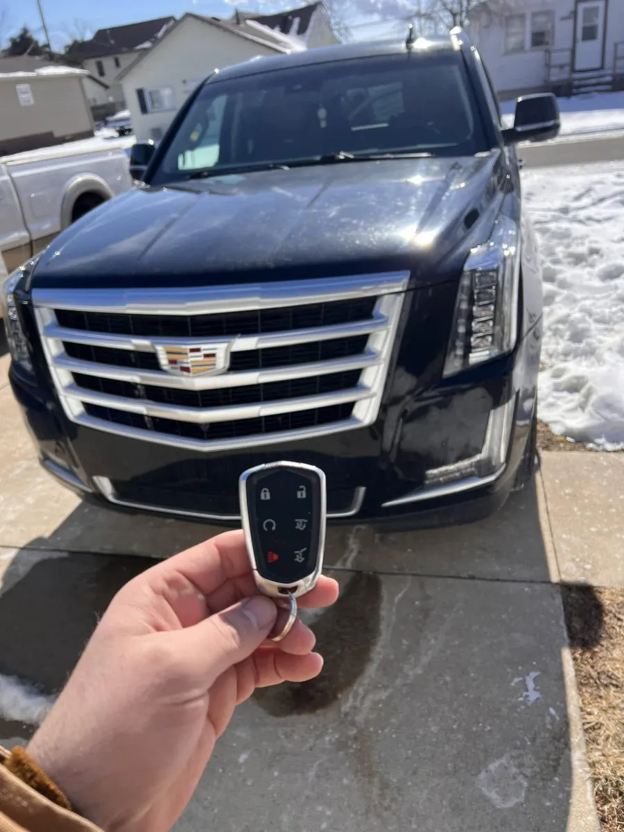 Smart key for a black Cadillac Escalade