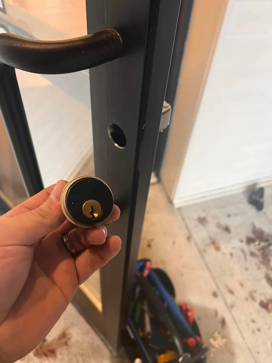 Lock cylinder removed from a storefront door