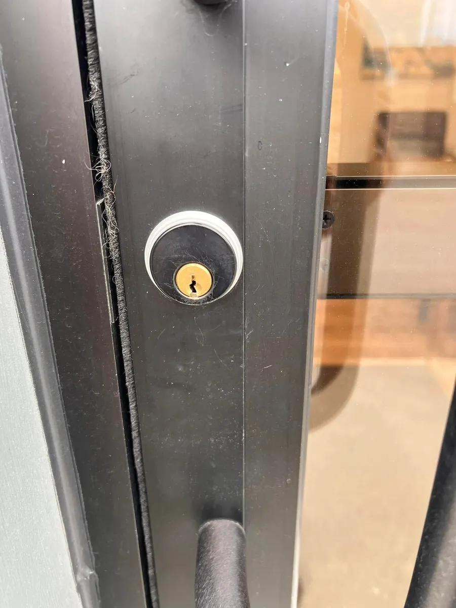 Lock cylinder on a storefront door
