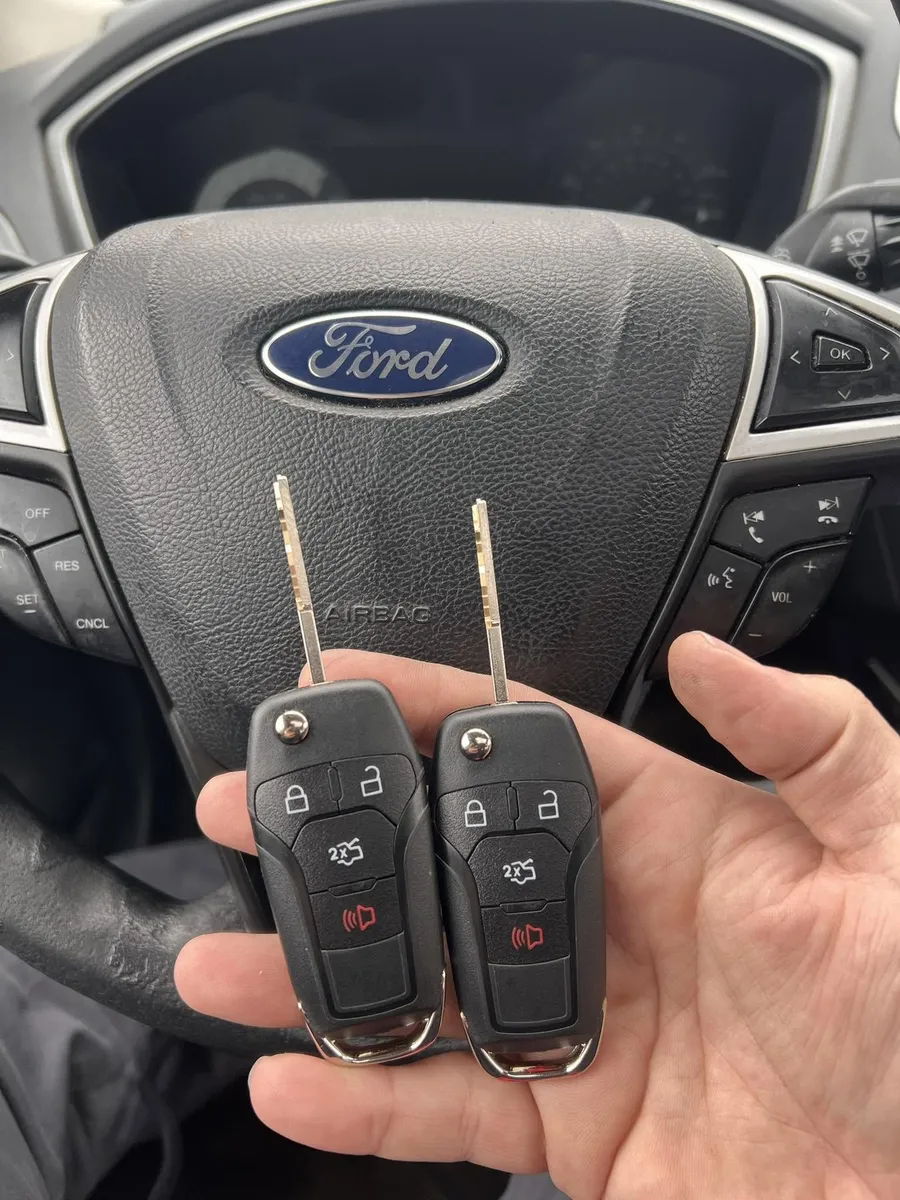Two Ford flip keys at the steering wheel