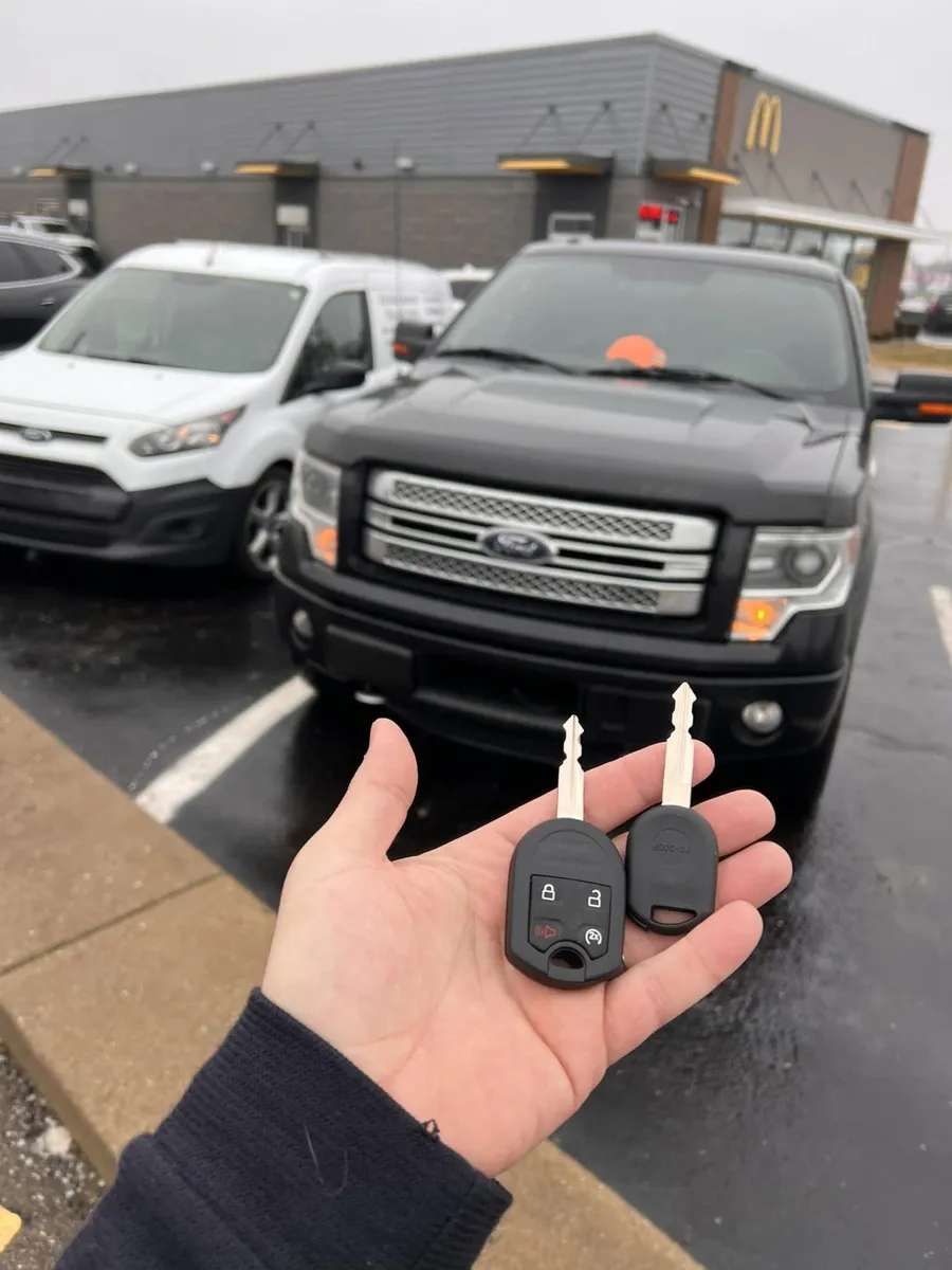 Two keys for a black Ford F-150, with the CS Lock and Key van