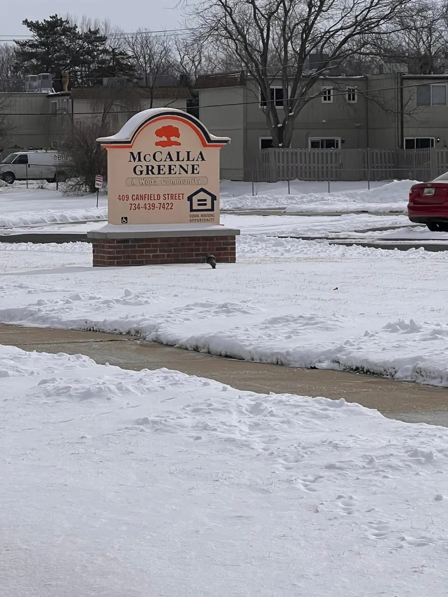 Apartment community sign in winter