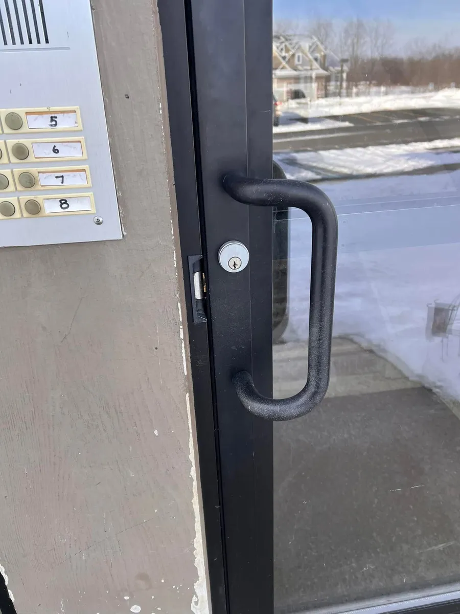 Pull handle and lock on a storefront door