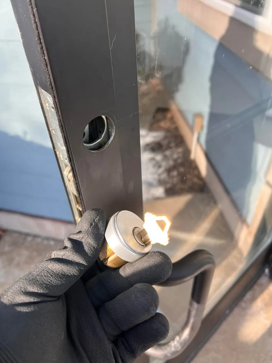Lock cylinder removed from a storefront door